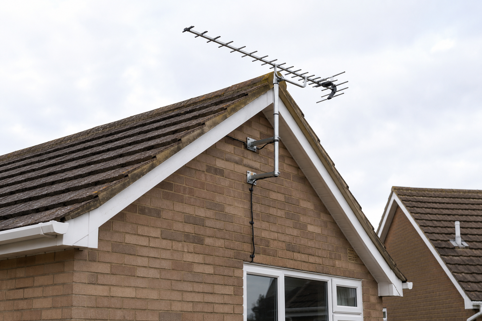 TV aerial installation on the side of a Birmingham home